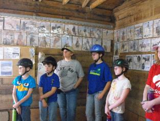 a Scout field trip listening to lecture