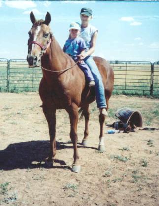 This is a favorite photo of Ashlea and Kelsea on CC - the horse I started the school with. She passed away.